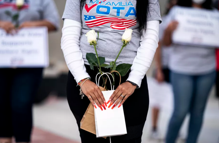 woman at rally for Latinx voters